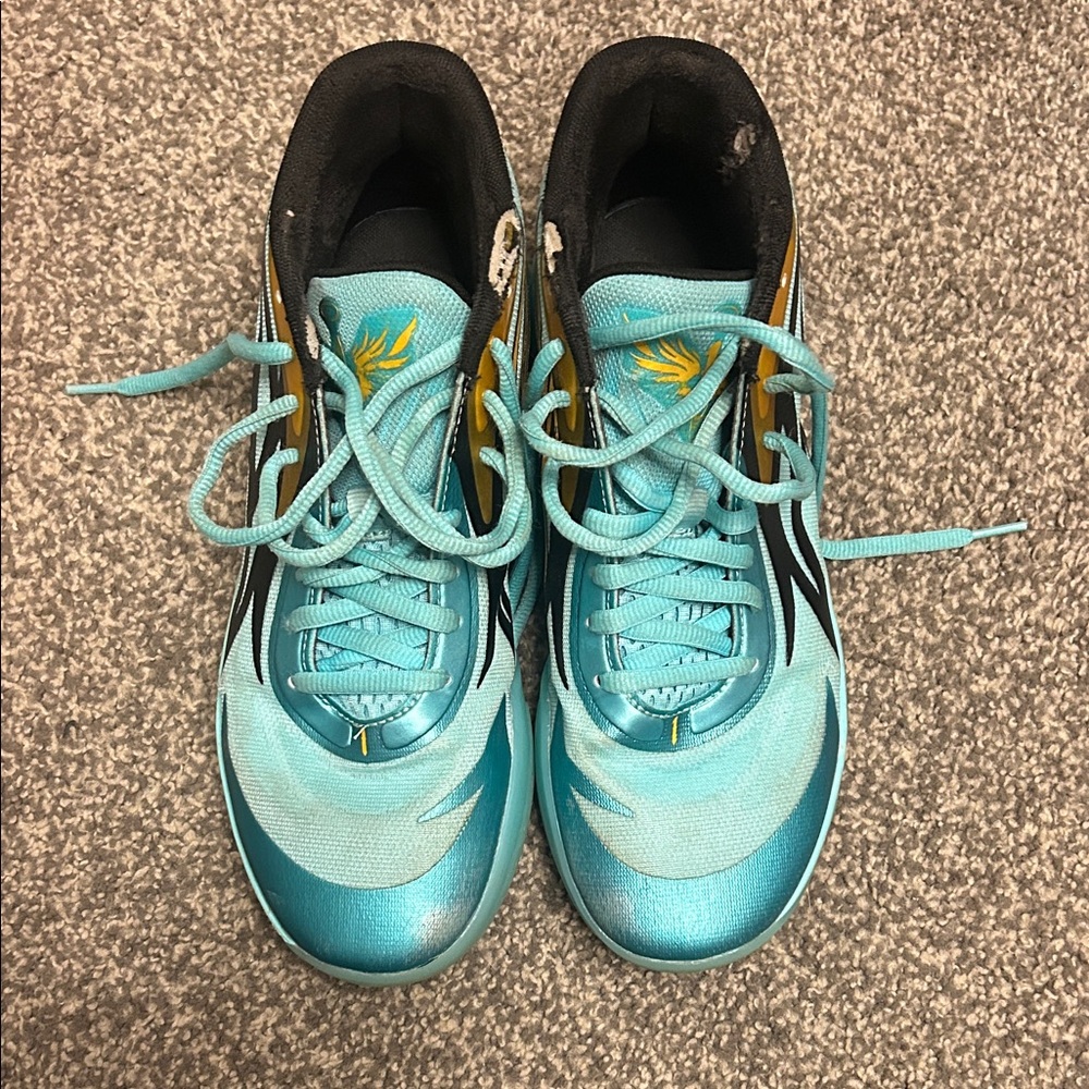 Puma Turquoise and Black Sneakers with Gold Accents